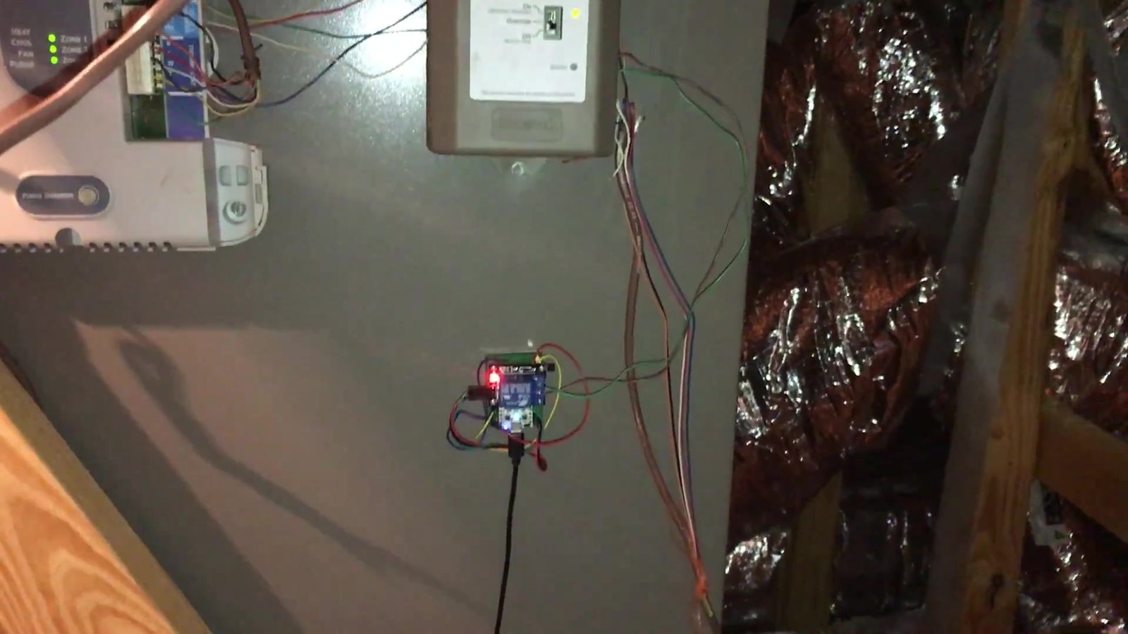 My homemade relay board mounted under the Honeywell ventilation control